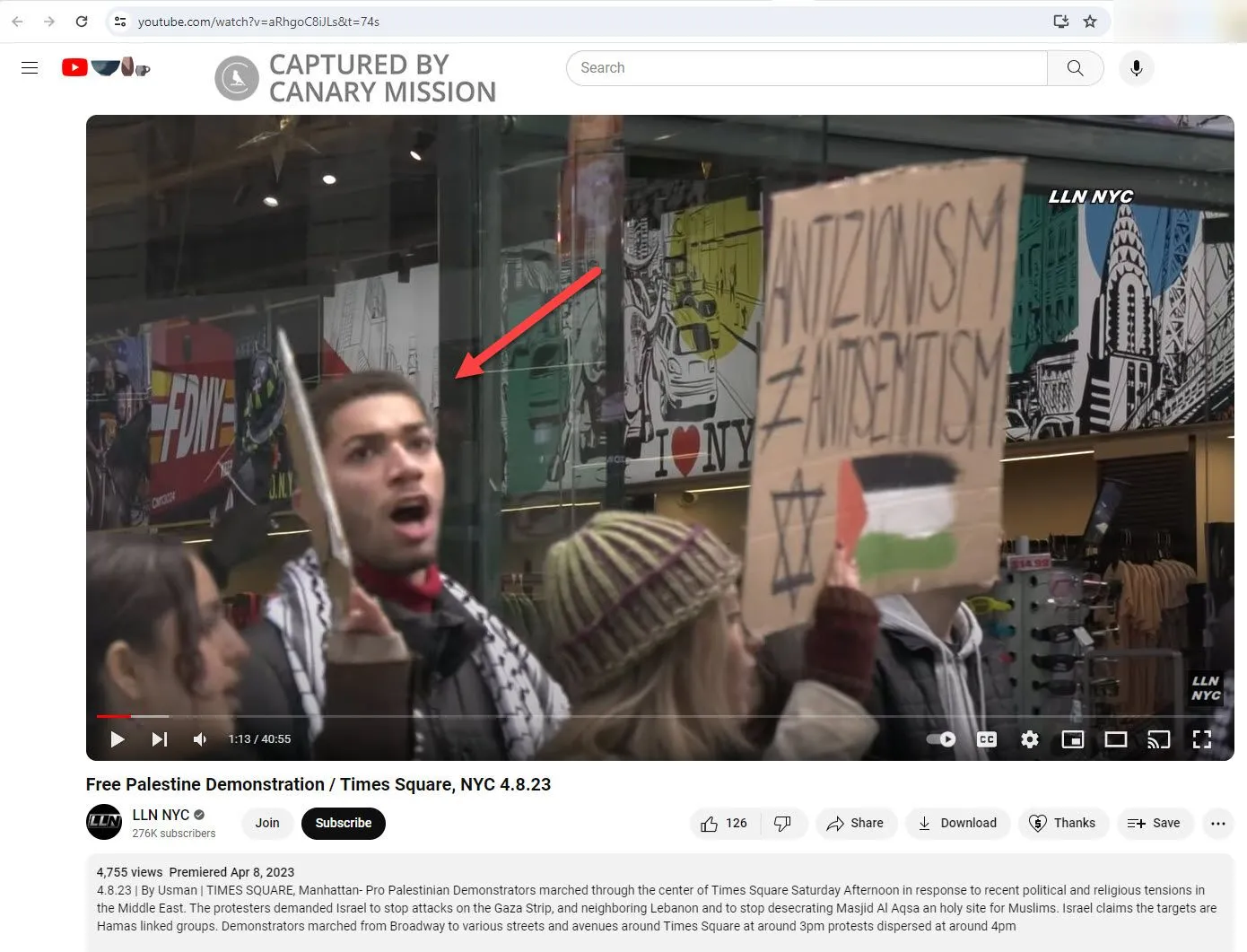 Cameron Jones appears at a protest featuring signs equating Zionism with antisemitism and endorsing anti-Israel violence.